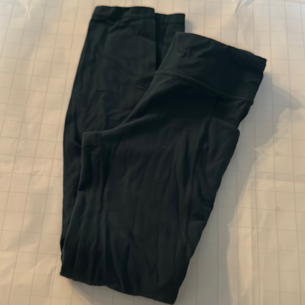 Athleta winter green or teal stash your treasures tight leggings.